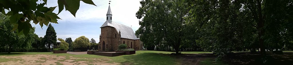The church hall, shaded parking in summer and the church